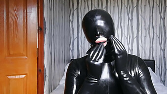 Latex-Clad Gimp Submits To Bondage And Domination