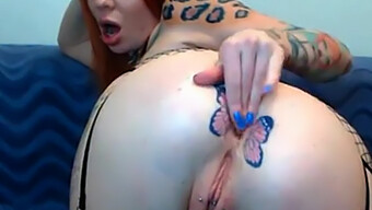 Tattooed Redhead Flaunts Her Butterfly Tattoo In Webcam Show